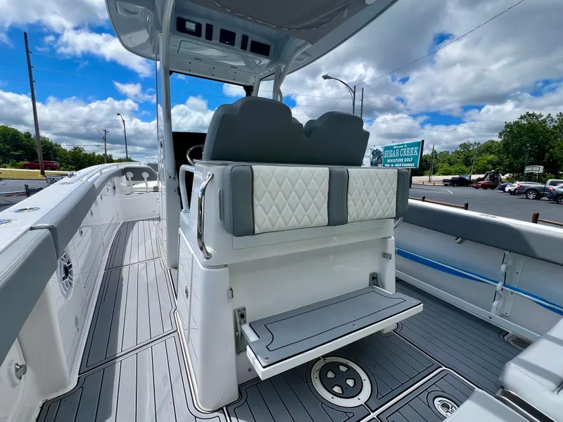 Slide: The Image of 2024 Everglades 285 Center Console boat interior with seating and deck view. - 9