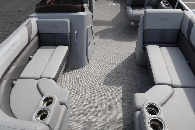 Slide: The Image of 2024 Bennington 22 SXSR pontoon boat interior with gray seating and cup holders. - 10