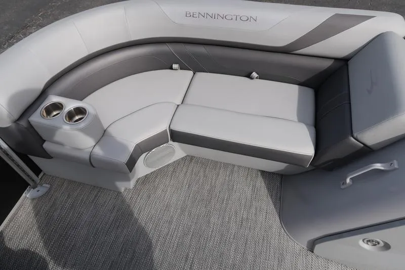 Slide: The Image of 2024 Bennington 22 SXSR boat interior with gray seating and cup holders. - 12