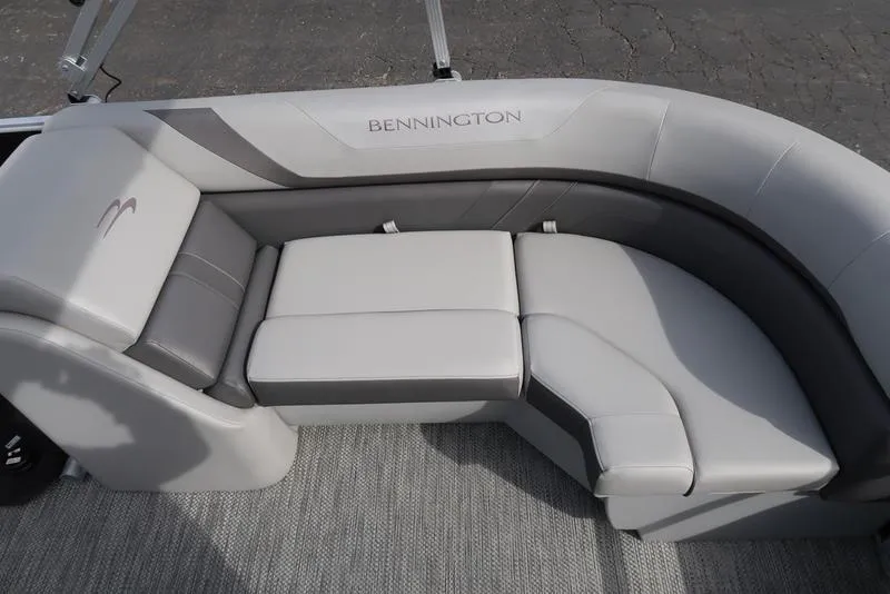 Slide: The Image of 2024 Bennington 22 SXSR boat interior with gray cushioned seating. - 20