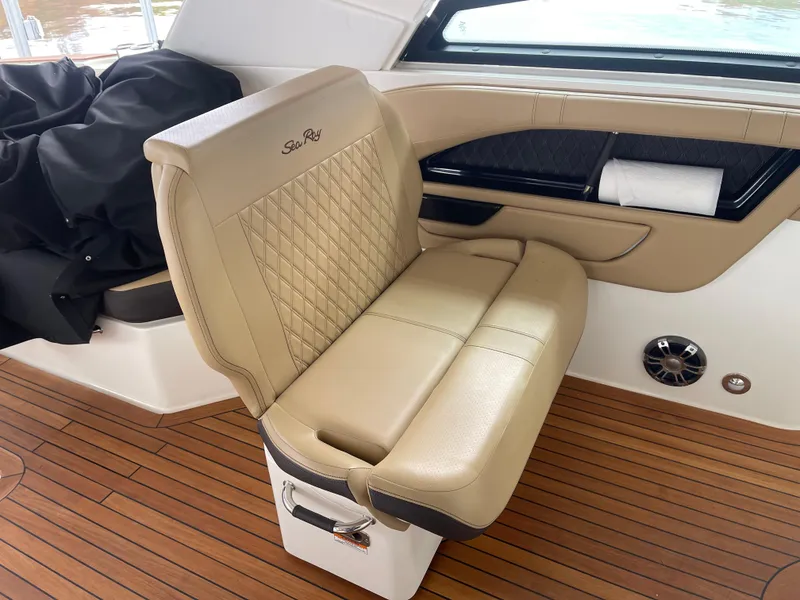Slide: The Image of Luxurious seating on 2022 Sea Ray 400 SLX boat with elegant design and wood flooring. - 20