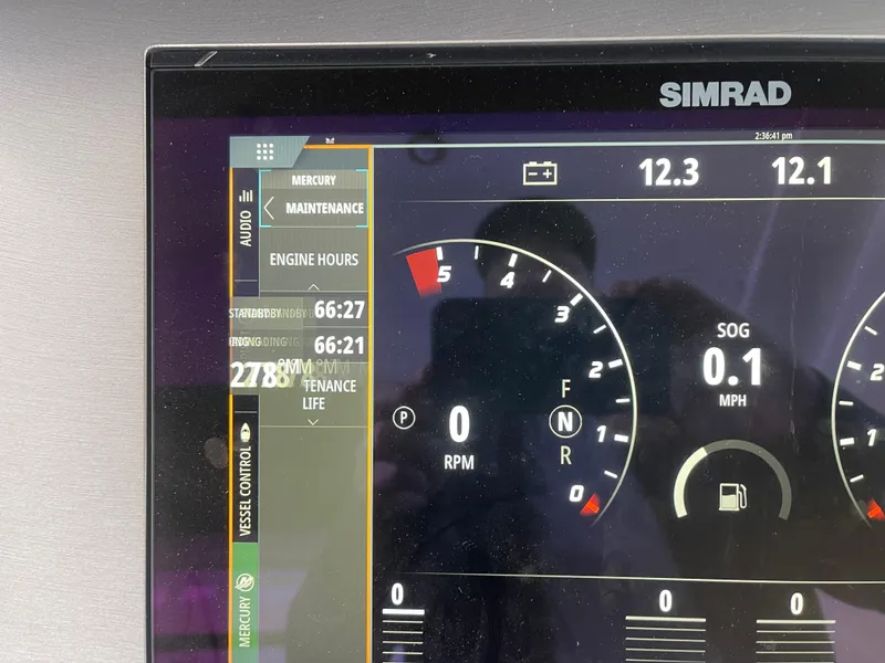 Slide: The Image of Simrad display on 2022 Sea Ray 400 SLX showing engine and speed data. - 27