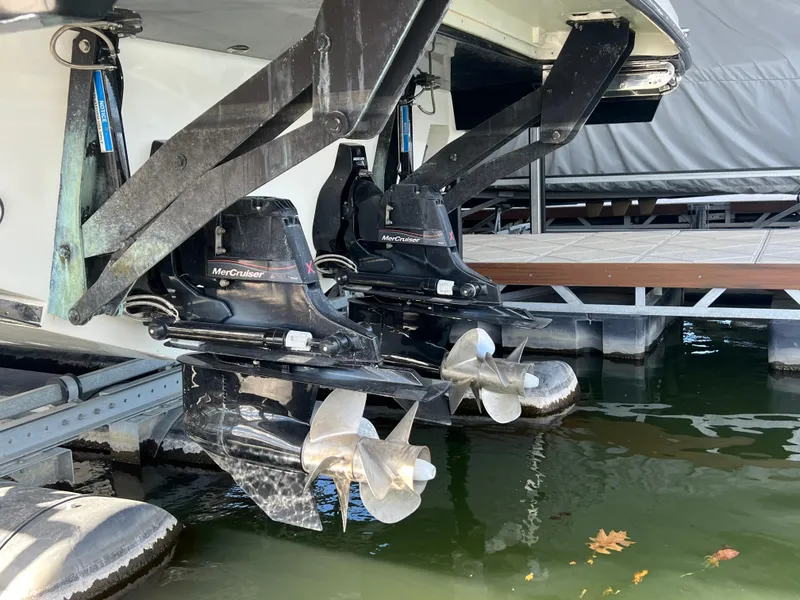 Slide: The Image of 2022 Sea Ray 400 SLX boat with dual MerCruiser outboard engines at dock. - 29