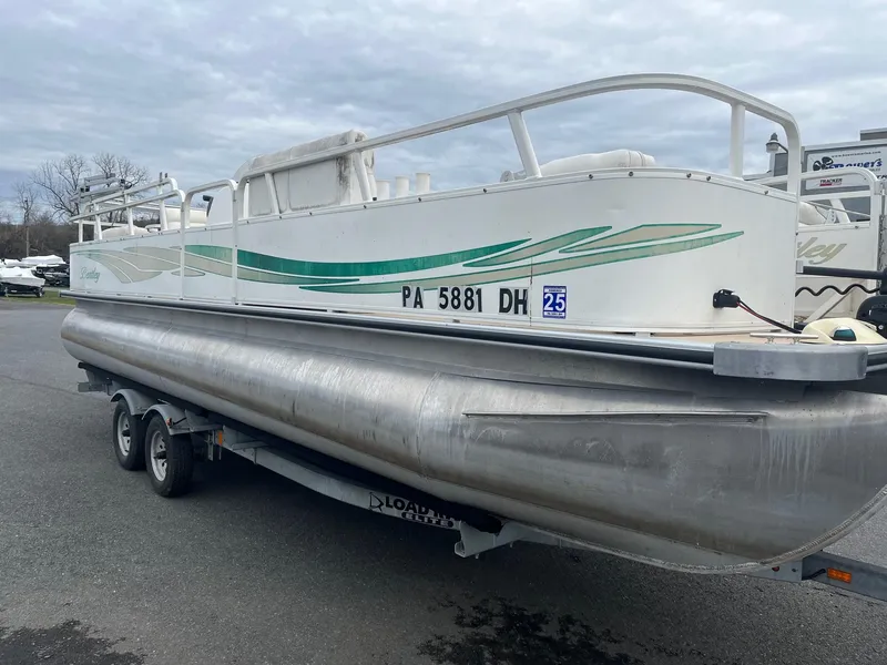 Slide: The Image of 2009 Bentley Pontoons 244 4-point boat on trailer, side view. - 3