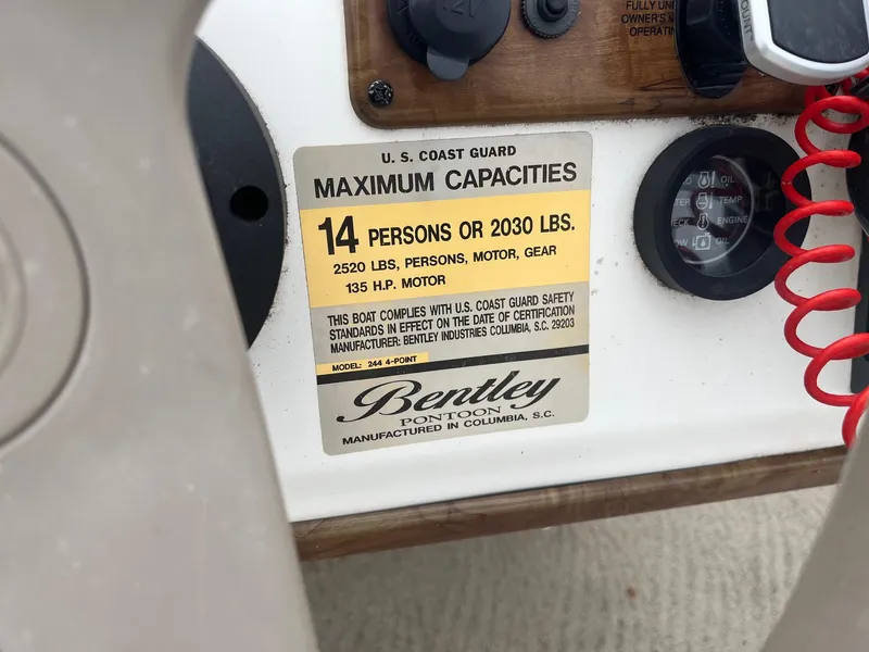 Slide: The Image of 2009 Bentley Pontoons 244 4-point capacity label, 14 persons or 2030 lbs, 135 HP motor. - 5