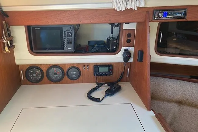 Slide: The Image of 1981 C&C Landfall 35 yacht interior with navigation equipment and communication devices. - 21