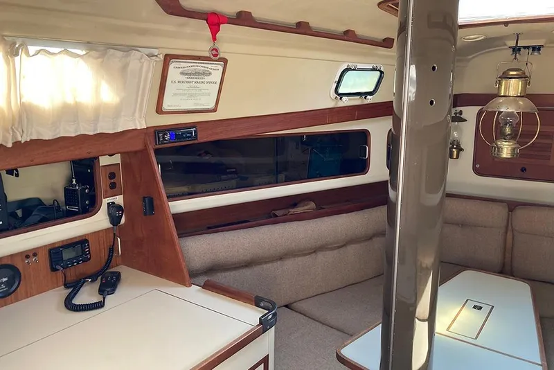 Slide: The Image of 1981 C&C Landfall 35 yacht interior with wood accents and nautical decor. - 28