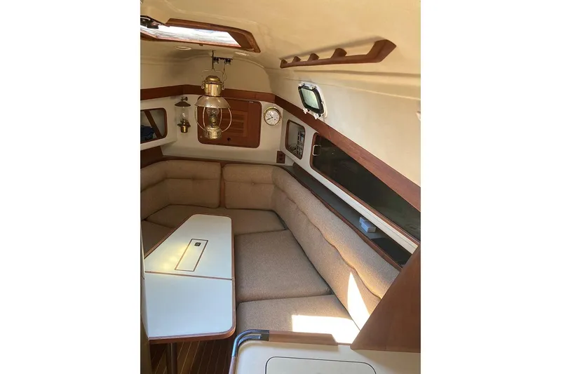 Slide: The Image of 1981 C&C Landfall 35 yacht interior with cozy seating and classic nautical decor. - 29