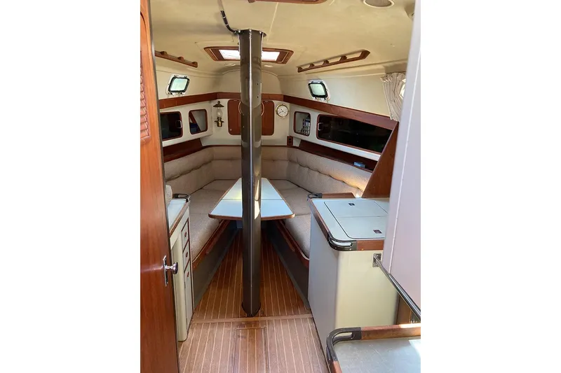 Slide: The Image of Interior of 1981 C&C Landfall 35 sailboat with cozy seating and wooden accents. - 32