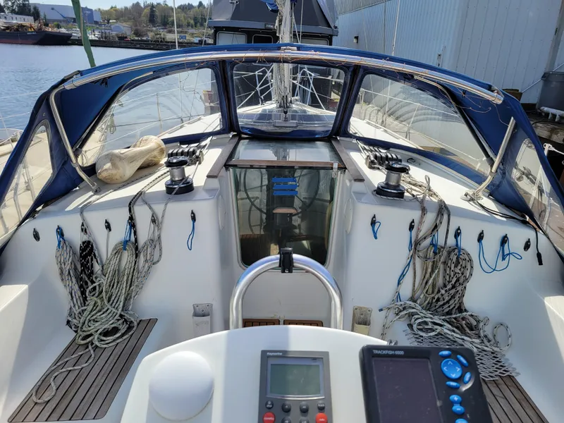 Slide: The Image of 2001 Jeanneau Sun Odyssey 37 sailboat cockpit with ropes and navigation equipment. - 13