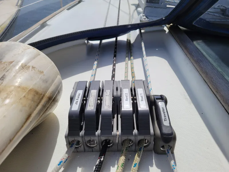 Slide: The Image of Rope clutches on a 2001 Jeanneau Sun Odyssey 37 sailboat deck. - 14