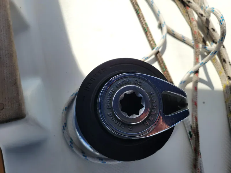 Slide: The Image of Winch on Jeanneau Sun Odyssey 37 sailboat, 2001 model, with ropes coiled around it. - 16