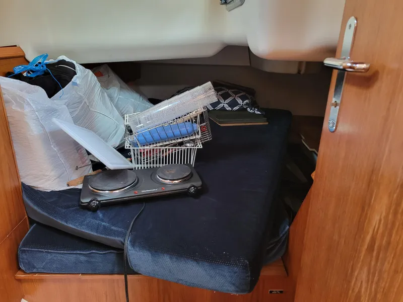 Slide: The Image of Interior cabin of 2001 Jeanneau Sun Odyssey 37 with storage items and hot plate. - 34