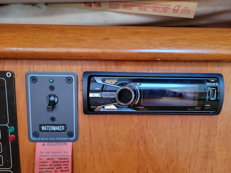 Slide: The Image of Control panel and stereo system on 2001 Jeanneau Sun Odyssey 37 yacht. - 37