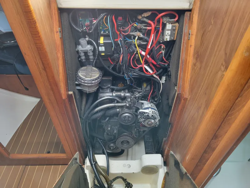 Slide: The Image of Engine compartment of a 2001 Jeanneau Sun Odyssey 37 sailboat, showing wiring and components. - 39