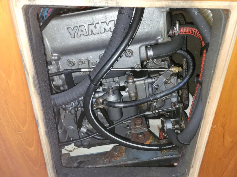 Slide: The Image of Engine compartment of a 2001 Jeanneau Sun Odyssey 37 sailboat, featuring a Yanmar engine. - 40