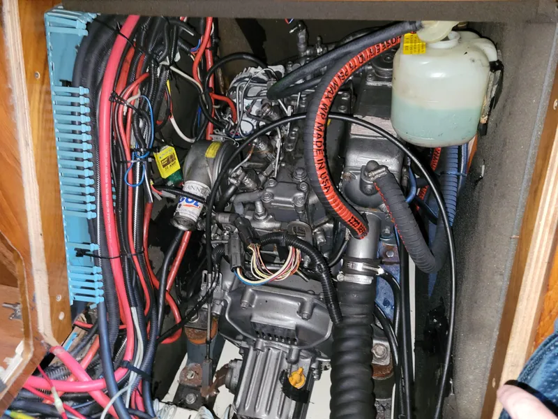 Slide: The Image of Engine compartment of a 2001 Jeanneau Sun Odyssey 37 sailboat, showing wiring and components. - 41