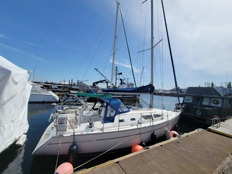 Slide: The Image of 2001 Jeanneau Sun Odyssey 37 sailboat docked at marina under clear sky. - 7