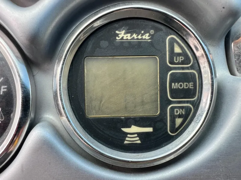 Slide: The Image of Close-up of Faria gauge on 2006 Crownline 240 EX boat dashboard. - 24