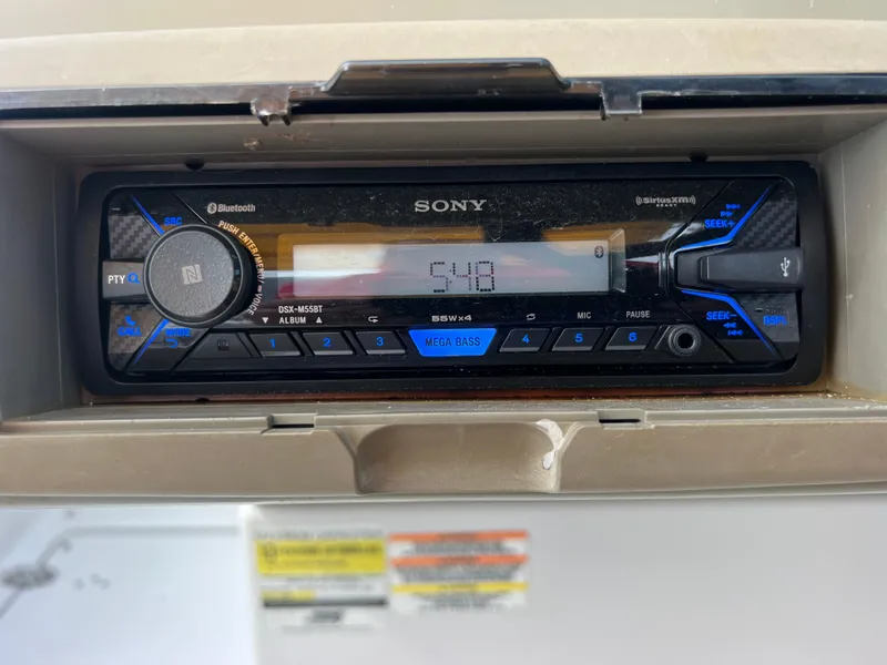 Slide: The Image of Sony car stereo in a 2006 Crownline 240 EX boat dashboard. - 25