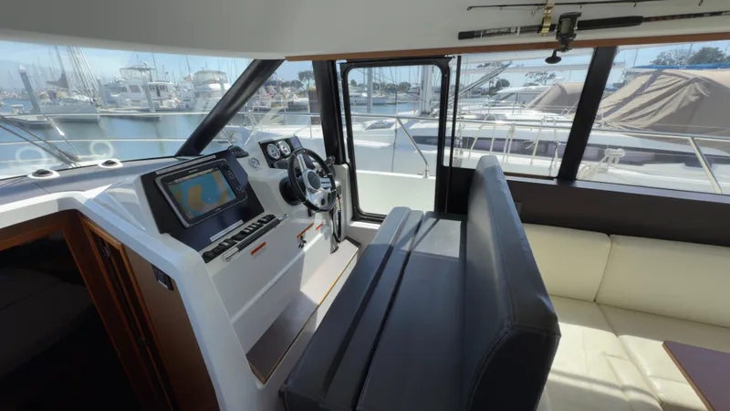 Slide: The Image of Interior view of 2016 Jeanneau Velasco 37F yacht helm with navigation equipment. - 10