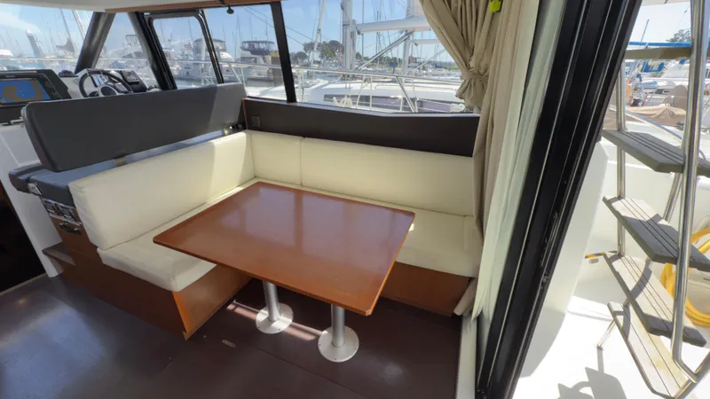 Slide: The Image of Interior of 2016 Jeanneau Velasco 37F with dining area and helm station. - 14