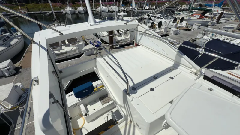 Slide: The Image of 2016 Jeanneau Velasco 37F yacht with spacious deck, docked at marina. - 16
