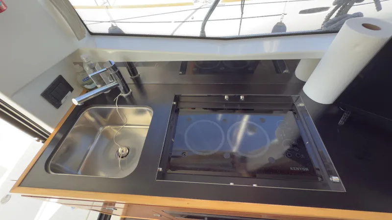 Slide: The Image of Modern kitchen area in 2016 Jeanneau Velasco 37F yacht with sink and stove. - 18