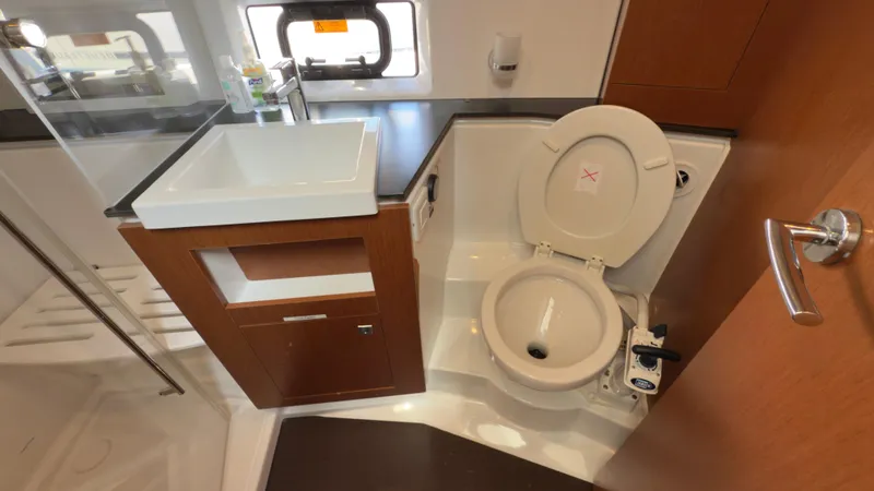Slide: The Image of Bathroom interior of 2016 Jeanneau Velasco 37F yacht with sink and toilet. - 21