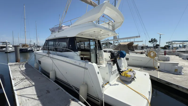 Slide: The Image of 2016 Jeanneau Velasco 37F yacht docked at marina under clear blue sky. - 28