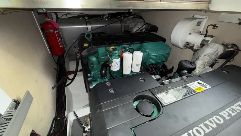 Slide: The Image of Engine room of 2016 Jeanneau Velasco 37F with Volvo Penta engine and fire extinguisher. - 33