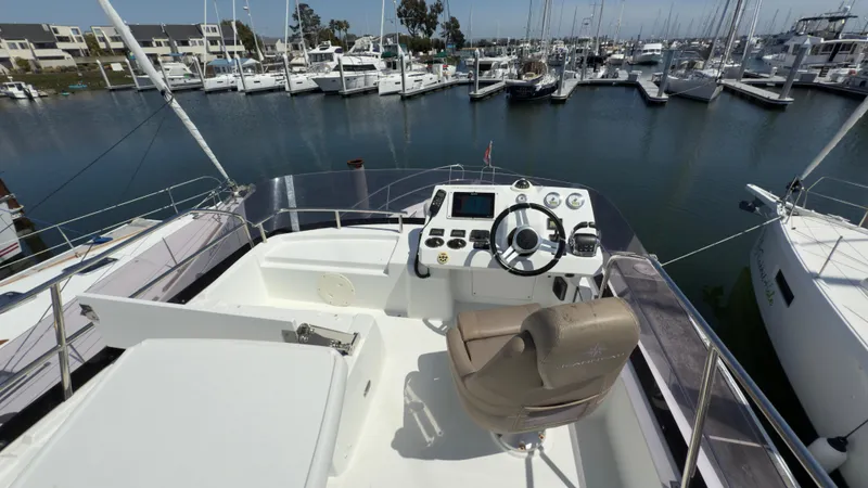 Slide: The Image of Flybridge of 2016 Jeanneau Velasco 37F yacht docked at marina. - 5