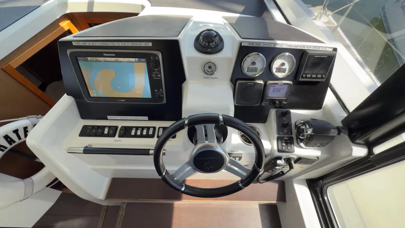 Slide: The Image of Helm of 2016 Jeanneau Velasco 37F with navigation display and controls. - 9