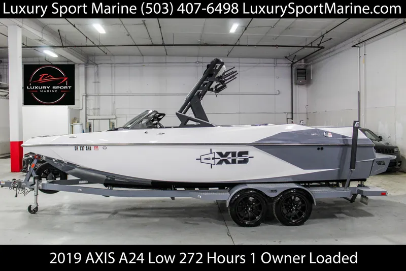 Slide: The Image of 2019 Axis A24 boat in showroom, low hours, single owner, fully loaded. - 0