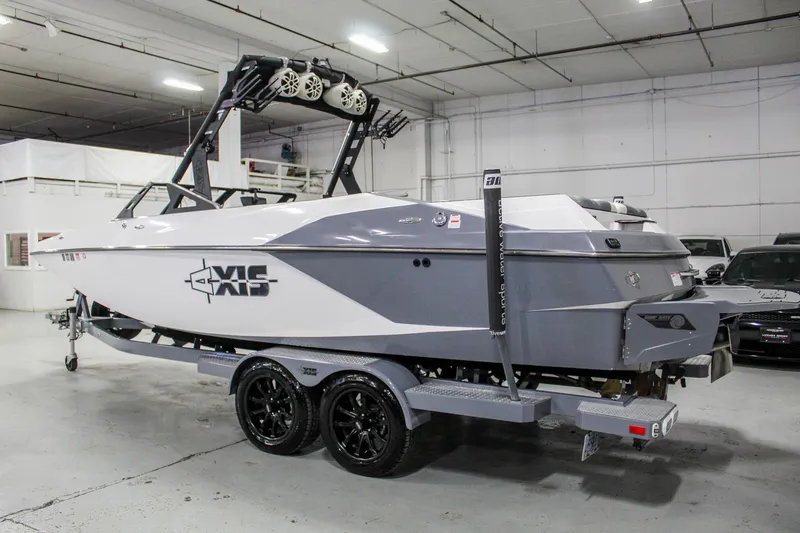 Slide: The Image of 2019 Axis A24 boat on trailer in indoor storage facility. - 1