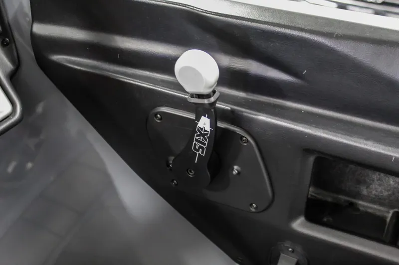 Slide: The Image of 2019 Axis A24 interior detail showing control lever and panel. - 15