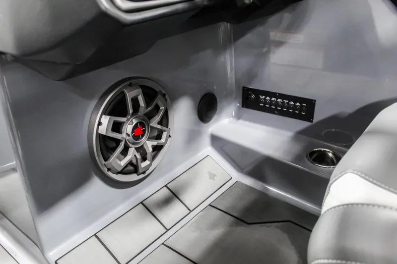 Slide: The Image of 2019 Axis A24 boat interior with speaker and control panel. - 16