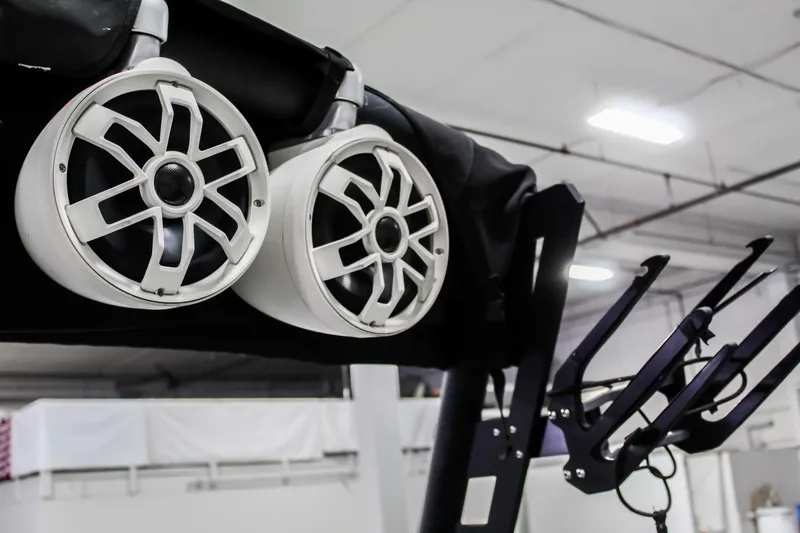 Slide: The Image of 2019 Axis A24 boat speakers and wakeboard rack in a showroom. - 33