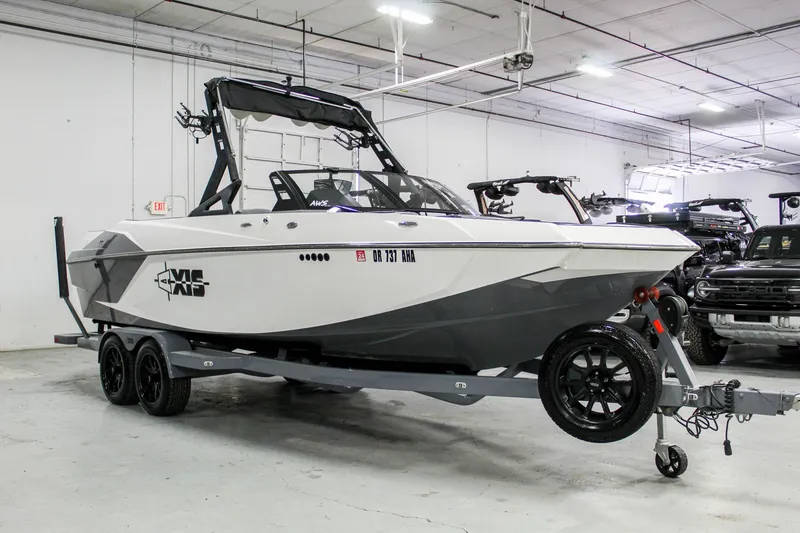 Slide: The Image of 2019 Axis A24 boat on trailer in indoor showroom. - 5