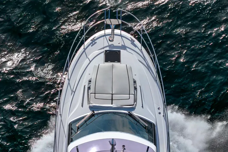 Slide: The Image of 2024 Bavaria R40 yacht cruising on open water, aerial view. - 17