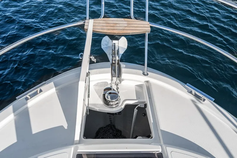 Slide: The Image of Bow of 2024 Bavaria R40 yacht with anchor and railing, on calm water. - 21