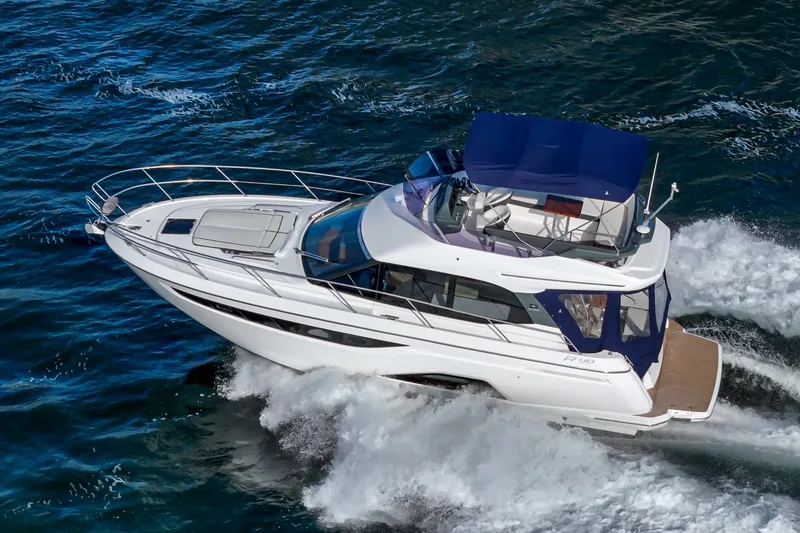 Slide: The Image of 2024 Bavaria R40 yacht cruising on open water, showcasing sleek design and luxury features. - 3