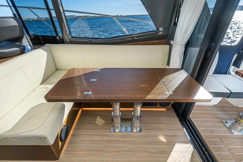 Slide: The Image of Luxurious interior of 2024 Bavaria R40 yacht with wooden table and ocean view. - 48
