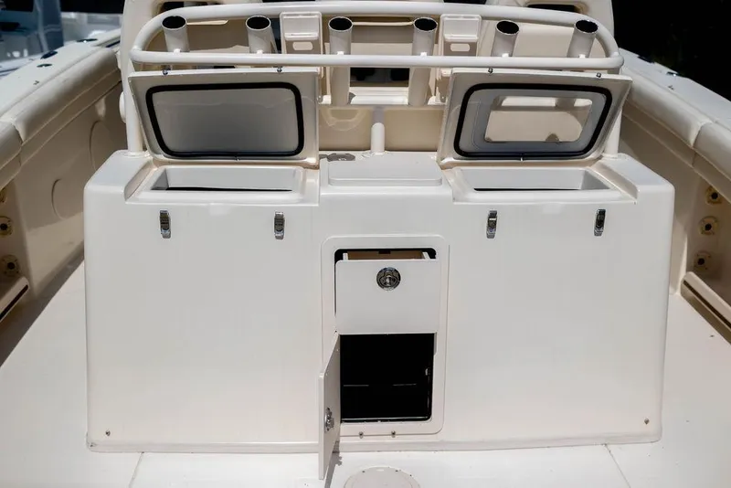 Slide: The Image of 2017 Grady-White Canyon 336 boat console with storage compartments and rod holders. - 10