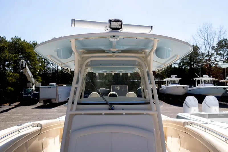 Slide: The Image of 2017 Grady-White Canyon 336 boat, center console view, parked outdoors. - 12