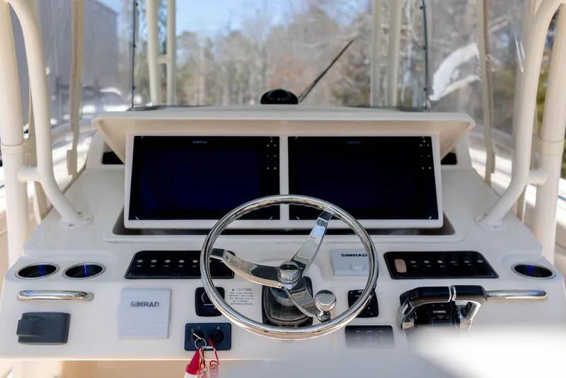 Slide: The Image of 2017 Grady-White Canyon 336 helm with dual displays and steering wheel. - 13