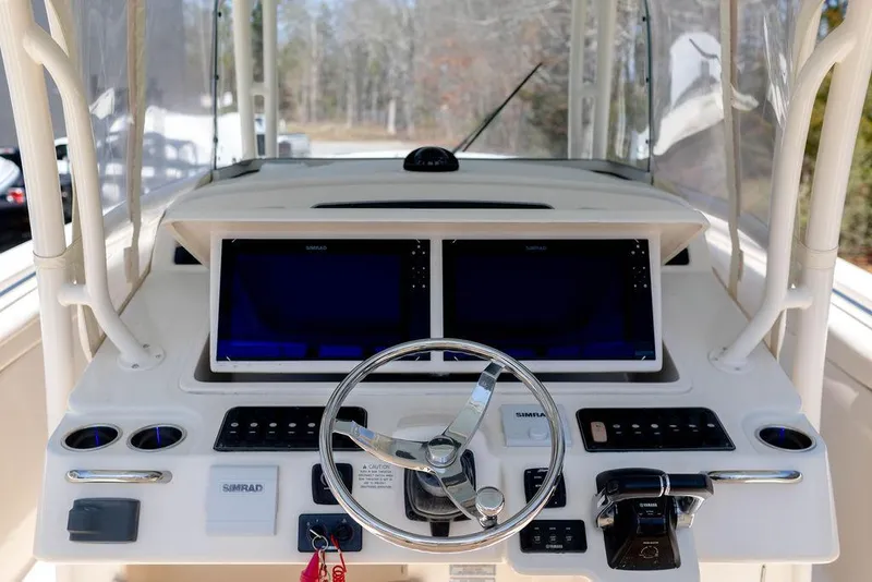 Slide: The Image of 2017 Grady-White Canyon 336 helm with dual displays and steering wheel. - 14