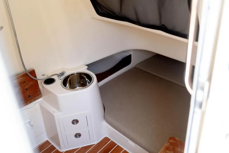 Slide: The Image of 2017 Grady-White Canyon 336 cabin interior with sink and storage drawers. - 20