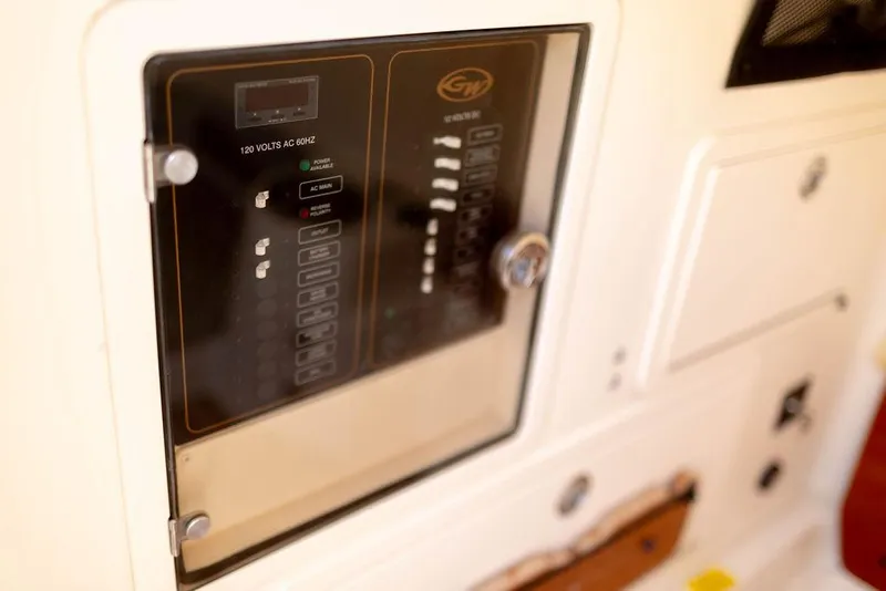 Slide: The Image of Control panel on 2017 Grady-White Canyon 336 boat, featuring switches and indicators. - 21