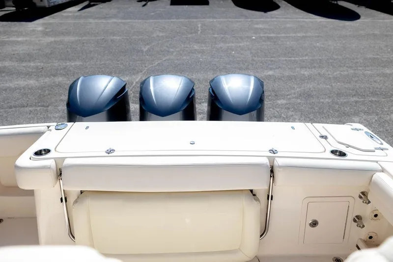 Slide: The Image of 2017 Grady-White Canyon 336 boat with triple outboard engines, rear view. - 8